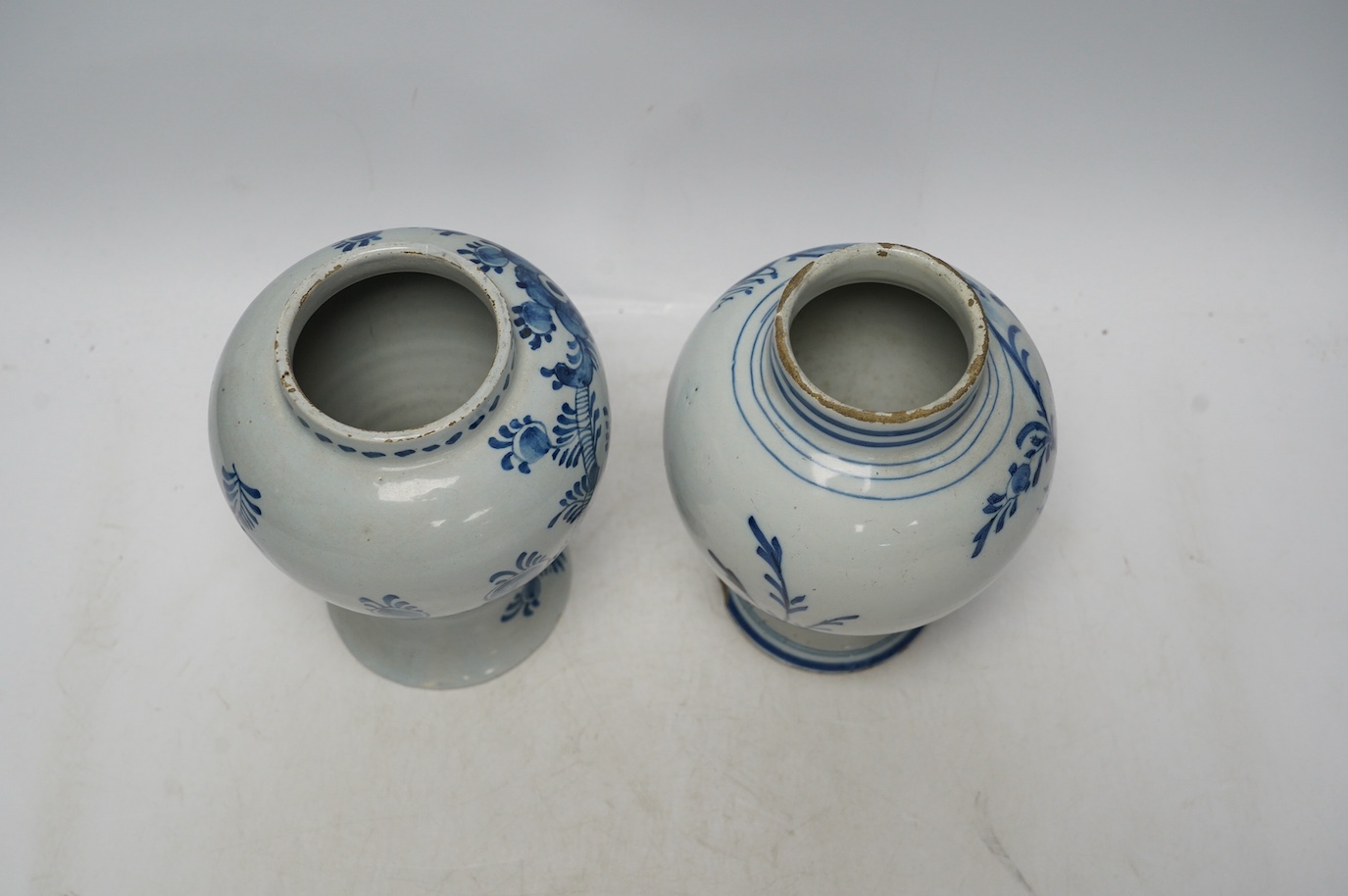 Two 18th century delft blue and white baluster vases, 18.5cm